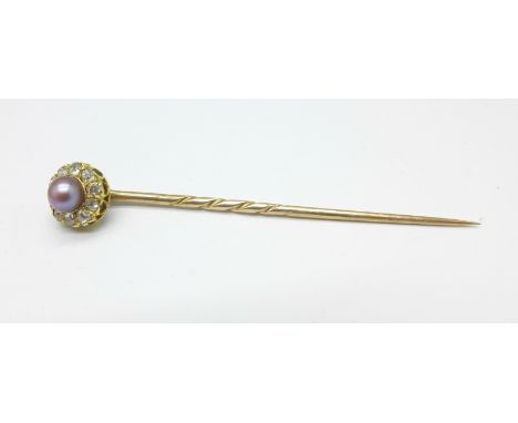 An old cut diamond and pearl set yellow metal stick pin