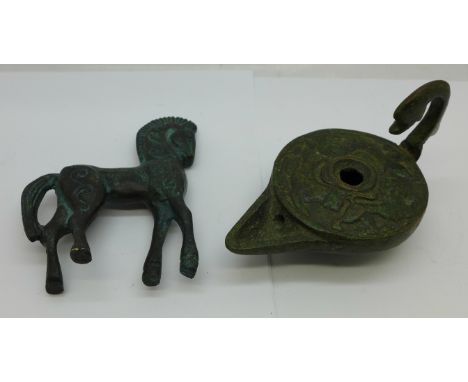 A bronze figure of a horse and a Roman style lamp, (tourist pieces) 