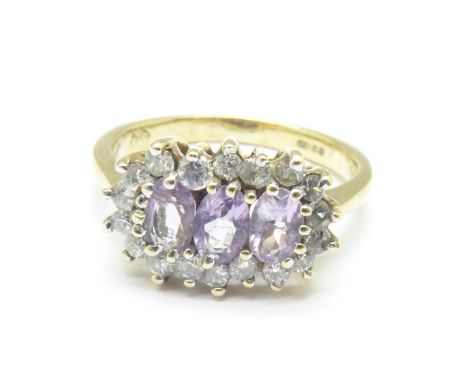 A 9ct gold, amethyst and zircon ring, 3g, K 