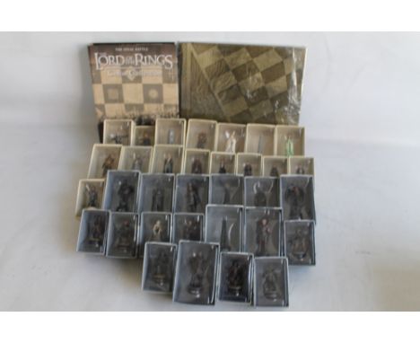 AN EAGLEMOSS NEW LINE CINEMA "LORD OF THE RINGS" CHESS SET, with boxed figures, unused board and related magazines in folders