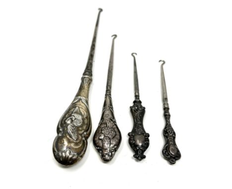 4 antique silver handle button hooks largest measures approx 35cm long 