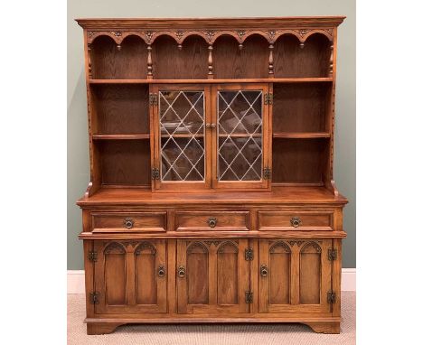 OLD CHARM REPRODUCTION OAK DRESSER with arched and baluster support gallery top shelf, above twin central leaded glazed doors