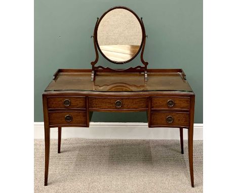 MAHOGANY SERPENTINE FRONT DRESSING TABLE &amp; AN OVAL FRAMED MAHOGANY TOILET MIRROR, the dressing table with a rail back and