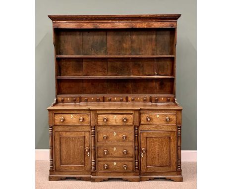 NORTH WALES/ANGLESEY OAK BREAKFRONT DRESSER - CIRCA 1830 WITH SPICE DRAWER RACK, dentil moulded cornice with diamond inlaid d