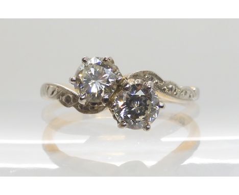 AN 18CT GOLD AND PLATINUM TWIN STONE DIAMOND RING set with estimated approx 0.80cts of brilliant cut diamonds in total, with 