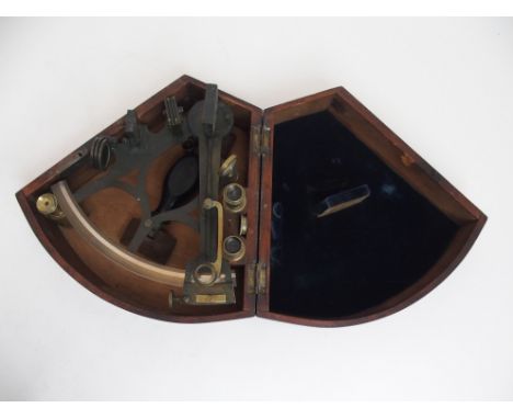 A VICTORIAN BRASS SEXTANT BY W. GERRARD, LIVERPOOL in a fitted mahogany box, together with several lenses and eye pieces Cond