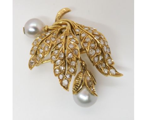 A BRIGHT YELLOW METAL PEARL AND DIAMOND BROOCH with continental hallmarks, set throughout with rose cut diamonds. The two pal