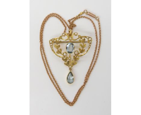A 9CT GOLD EDWARDIAN AQUAMARINE AND PEARL PENDANT BROOCH of classic design dimensions 4.5cm x 3.2cm, length of the 9ct vintag