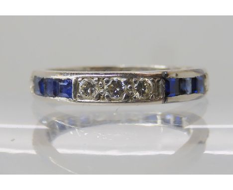 A SAPPHIRE AND DIAMOND ETERNITY RING set with square sapphires approx 2mm x 2mm and grain set brilliant cut diamonds, to an e