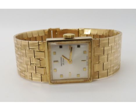 A 9CT GOLD RETRO LADIES RECORD DE LUXE WRISTWATCH with square cream dial, baton and squared numerals, and integral engraved s
