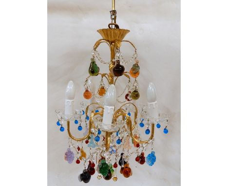 A MURANO GLASS CHANDELIER the gilt metal five branch frame hung with coloured glass fruits and flowers, with crystal swags, 5