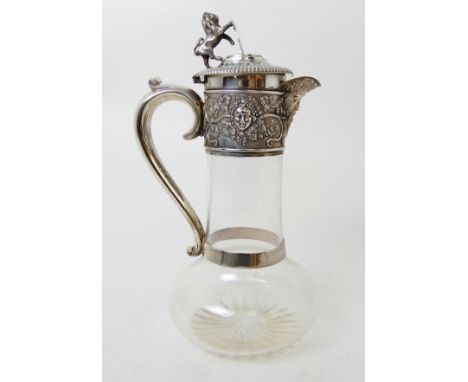 A LATE VICTORIAN SILVER MOUNTED CLARET JUG by Henry Wilkinson & Co. Limited, London 1898, the hinged cover with rampant lion 