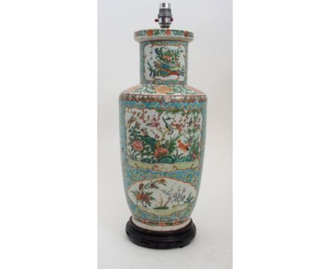 A CANTON FAMILLE ROSE BALUSTER VASE painted with panels of birds and butterflies amongst foliage within gilt frames, 44cm hig