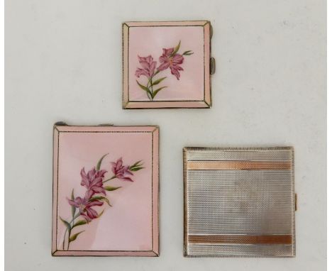 A SILVER AND FLORAL ENAMEL CIGARETTE CASE by Henry Clifford David, Birmingham 1948, 10cm x 8cm with a matching compact, 7cm s