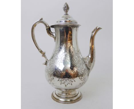A VICTORIAN SILVER COFFEE POT probably by William Hunter, London 1842, of baluster shape with scrolling handle, engraved deco