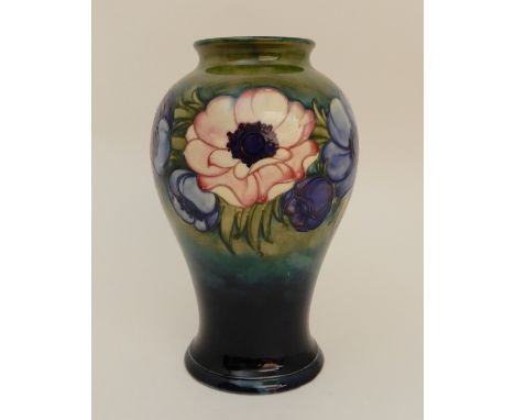 A MOORCROFT ANEMONE PATTERN VASE of bulbous tapering form, the green/blue ground with blue, purple and pink flowers, with inc