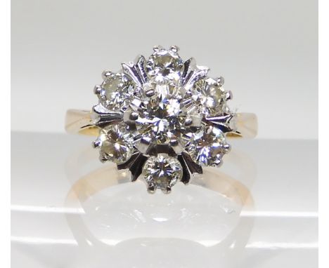 AN 18CT GOLD DIAMOND FLOWER RING set with estimated approx 1ct of diamonds in total. Finger size K, weight 4.3gms Condition R