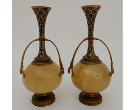 A PAIR OF ONYX AND GILDED METAL VASE GARNITURES with coloured enamel decoration, 23.5cm high (2) Condition Report: one has a 