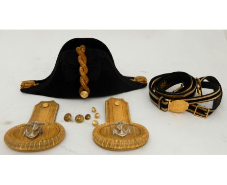 A BRITISH ROYAL NAVY BICORN HAT WITH A PAIR OF EPAULETTES by Gieve, Matthews & Seagrove, in tin box with maker's plaque and a