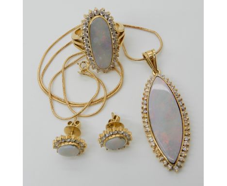 A SUITE OF ARABIC GOLD, WHITE OPAL AND CLEAR GEM SET JEWELLERY to include a ring, stamped 18k with Arabic stamps set with a w