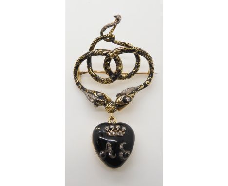 AN EARLY VICTORIAN SERPENT MOURNING BROOCH made in bright yellow metal set throughout with rose cut diamonds with black ename