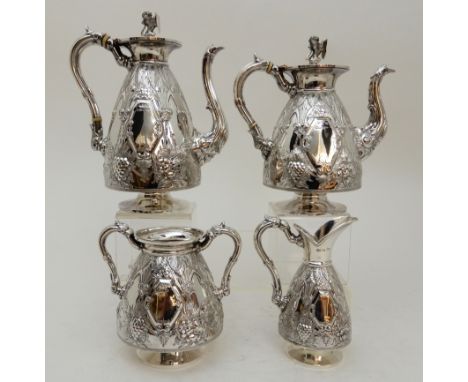 AN EDWARDIAN SILVER FOUR-PIECE TEA AND COFFEE SERVICE by Walker &amp; Hall, Sheffield 1901, pear shaped with foliate and flow