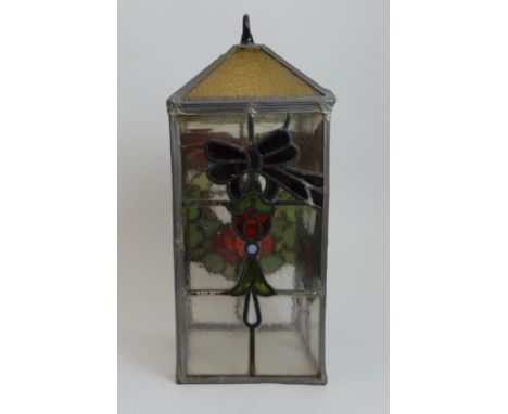 A LEADED AND STAINED GLASS HALL LIGHT of long square form, with decoration of Glasgow rose and ribbon bows, with hanging hook