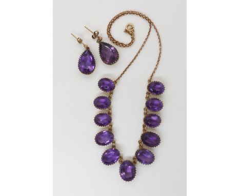 A 9CT AMETHYST FRINGE NECKLACE AND EARRING SET the amethysts are set in galleried mounts, largest amethyst 14mm x 11mm, small