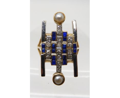 A DIAMOND BLUE GEM AND PEARL RETRO RING mounted in unhallmarked bright yellow and white metal. Head size approx 2.6cm x 1.3cm