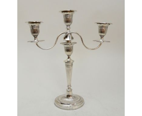AN EDWARDIAN SILVER THREE-LIGHT CANDELABRUM by Fordham &amp; Faulkner, Sheffield 1906, the removable drip pans with gadrooned
