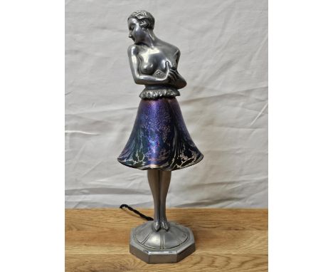 An Art Deco spelter and iridescent glass table lamp, signed Brevete to the base. H.34cm. 