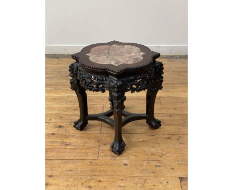 A late 19th century Chinese rosewood jardiniere stand, the top inset with breche violette marble panel framed within beaded b
