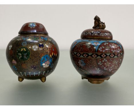 A Japanese cloisonne enamel jar and cover, Meiji period, of shaped spherical form, the domed cover with dog finial, some of t