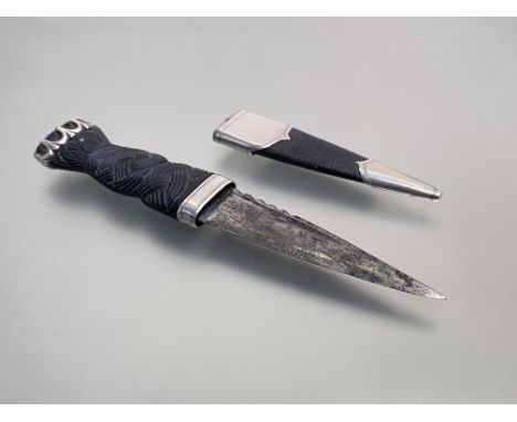 A George V silver-mounted sgian dubh, Thomas Ebbutt, Edinburgh 1928, the plaited carved handle claw-set to the pommel with sm