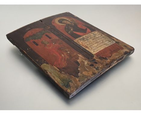 Russian School, an icon depicting the Virgin and Child, a worshipper to one side, the figures depicted in an arcade against a
