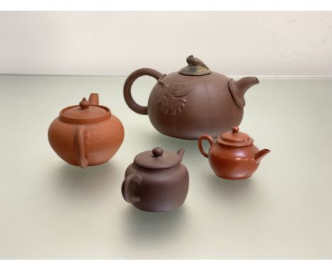 A Chinese Yixing red stoneware teapot modelled as a pumpkin with leaves in relief and with carved hardstone cover with bird f