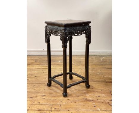 A late 19th century Chinese hardwood jardiniere stand, the square top with breche violette panel over frieze carved with scro