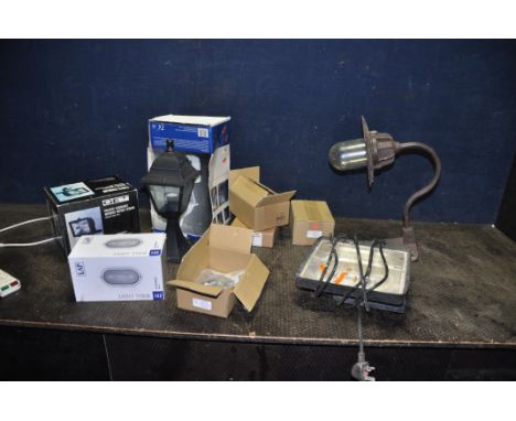 A COLLECTION OF OUTDOOR AND SITE LIGHTING including a mid 20th Century cast iron lamp with corner bracket, etc