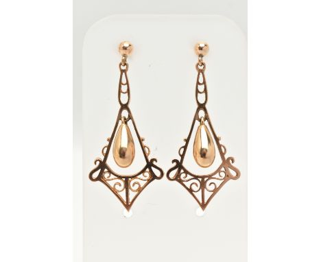 A PAIR OF 9CT GOLD DROP EARRINGS, each of an open work scrolling design with a central polished tear shape dropper, to the po