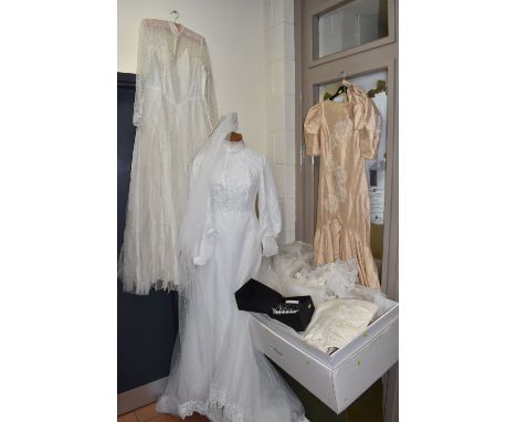 THREE VINTAGE WEDDING DRESSES AND VEILS, comprising a boxed Polly Edwards 'Florence' tiara, a white cathedral length veil wit