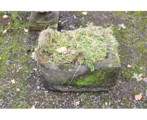 A PERIOD WEATHERED SANDSTONE PUMP TROUGH with one rounded end and exit holes width 51cm depth 38cm height 26cm (Condition Rep
