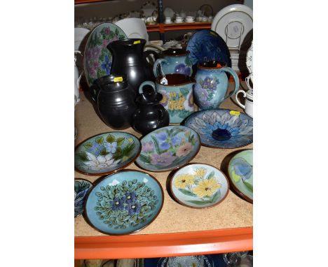 A GROUP OF CHELSEA AND PRINKNASH CERAMICS comprising a group of nine Chelsea Pottery floral dishes and three jugs, all marked