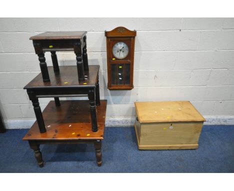 A PINE LIDDED STORAGE BOX, width 74cm x depth 47cm x height 44cm, a pine table, two hardwood tables, and a wall clock (condit
