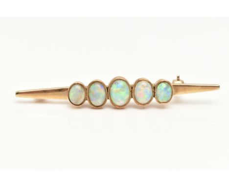 A YELLOW METAL OPAL BAR BROOCH, designed with a row of five oval cut white opal cabochons, each in a milgrain collet setting,
