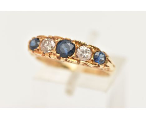 AN 18CT GOLD DIAMOND AND SAPPHIRE RING, set with three circular cut blue sapphires, interspaced with two round brilliant cut 