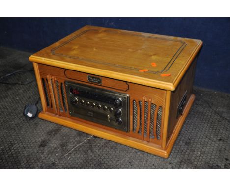 A VINTAGE COLLECTION GRAMOPHONE with turntable, CD, Radio and Tape player (PAT pass and working)