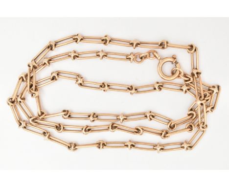 A 9CT GOLD FANCY LINK CHAIN, designed as elongated links interspaced with cross links, fitted with a bolt spring clasp, hallm