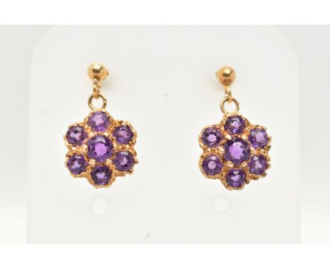 A PAIR OF 9CT GOLD AMETHST DROP EARRINGS, each earring of a circular cluster drop set with seven circular cut amethysts, to t