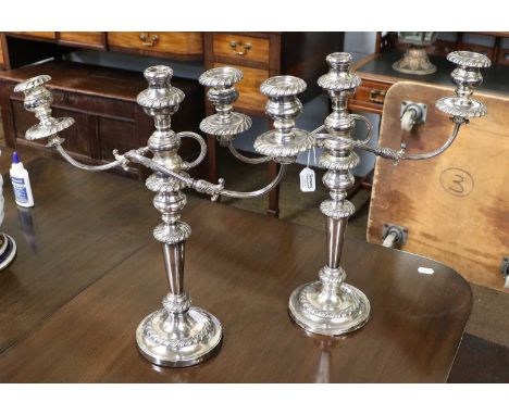 A Pair of Silver Plate Three-Light Candelabra, each with gadrooned borders, 47cm high (2)