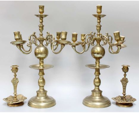 A Pair of Brass Five Light Candelabra Dutch Style, 45cm high, together with a pair of brass candlesticks ornamented to the dr